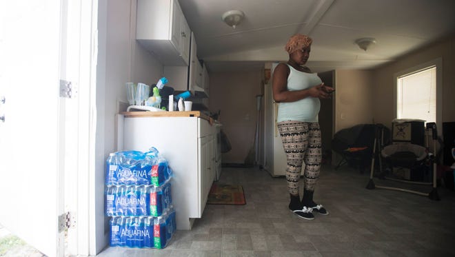 Raven Adams took her infant son to doctor because he developed dry spots on his legs. They told her to use more purified water to bathe him, even though she had boiled the well water from the Charleston Park trailer. She pays acquaintances for rides to a convenience store to get bottled water.  