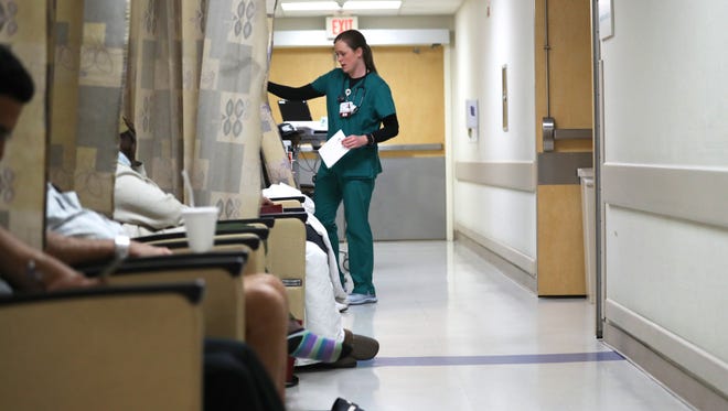 During a 2018 outbreak, the Capital Regional Medical Center emergency room set extra stations up in their halls as they grappled with a larger than normal patient intake due to that year's high number of flu cases.