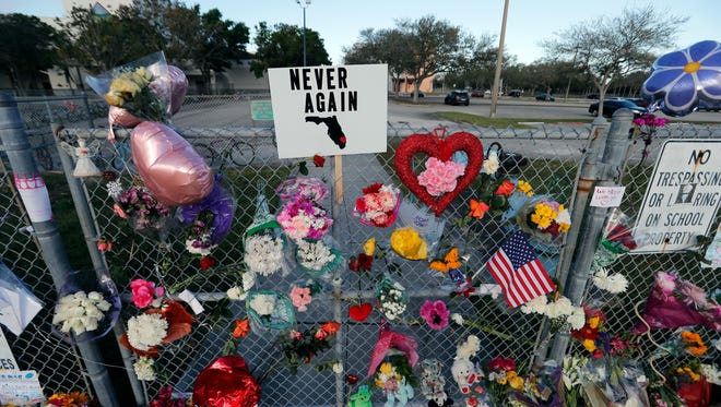 A makeshift memorial is seen outside the Marjory Stoneman Douglas High School, where 17 students and faculty were killed in a mass shooting on in Parkland, Fla.