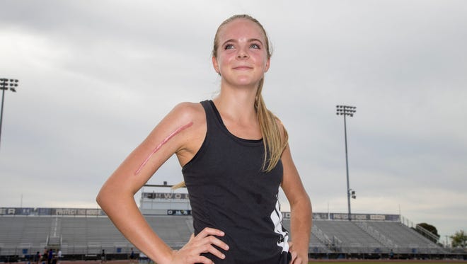 Morgan Foster, a junior who runs track & field, poses for a photo at Chandler High School, where she set the state girls record in the 800 meters her freshman year.