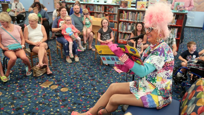 Bella da Ball reads to children and parents at the Palm Springs Library's second Drag Queen Story Hour on Wednesday, June 6, 2018. 