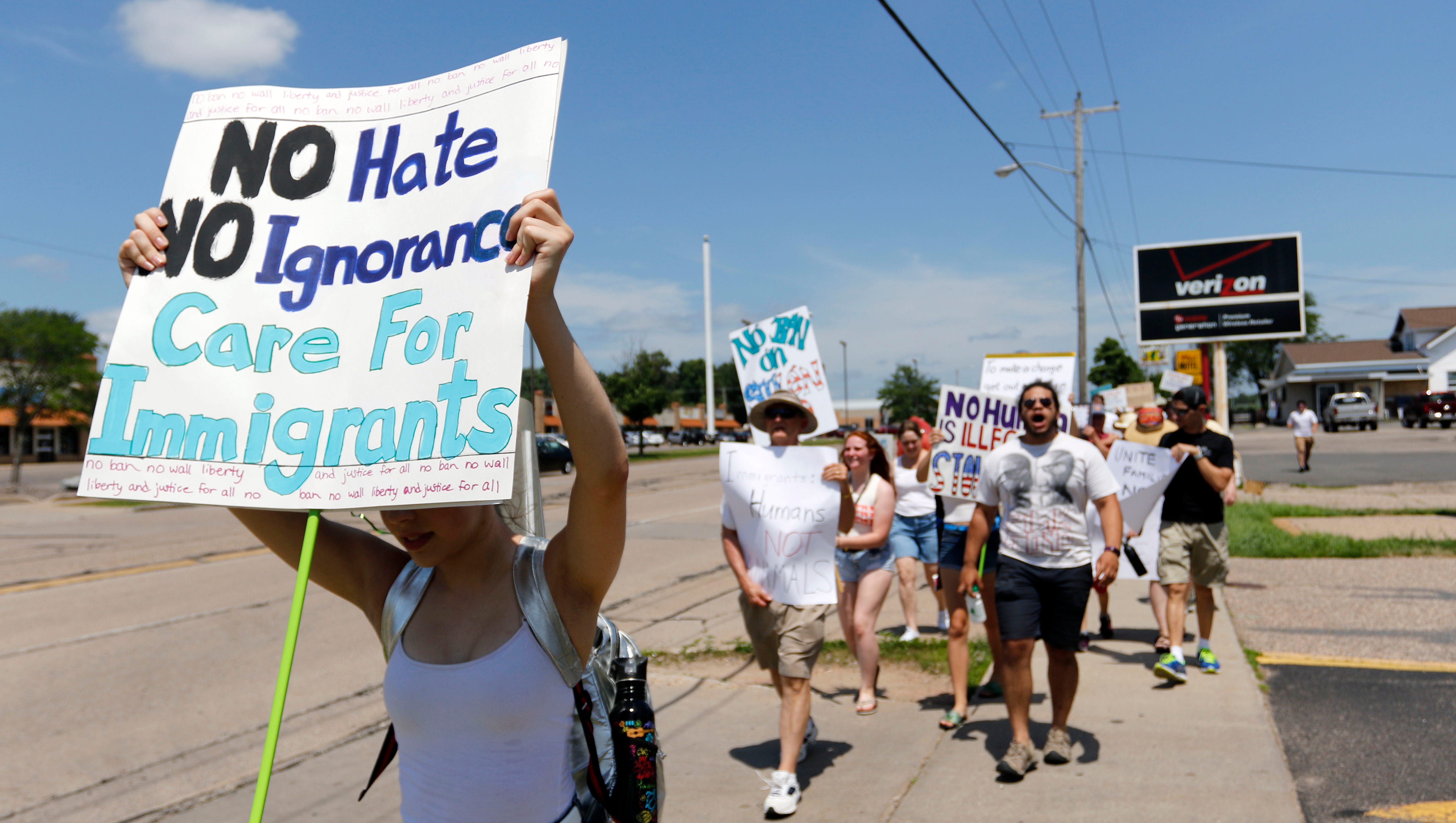 Protestors chant while marching south on Division street
