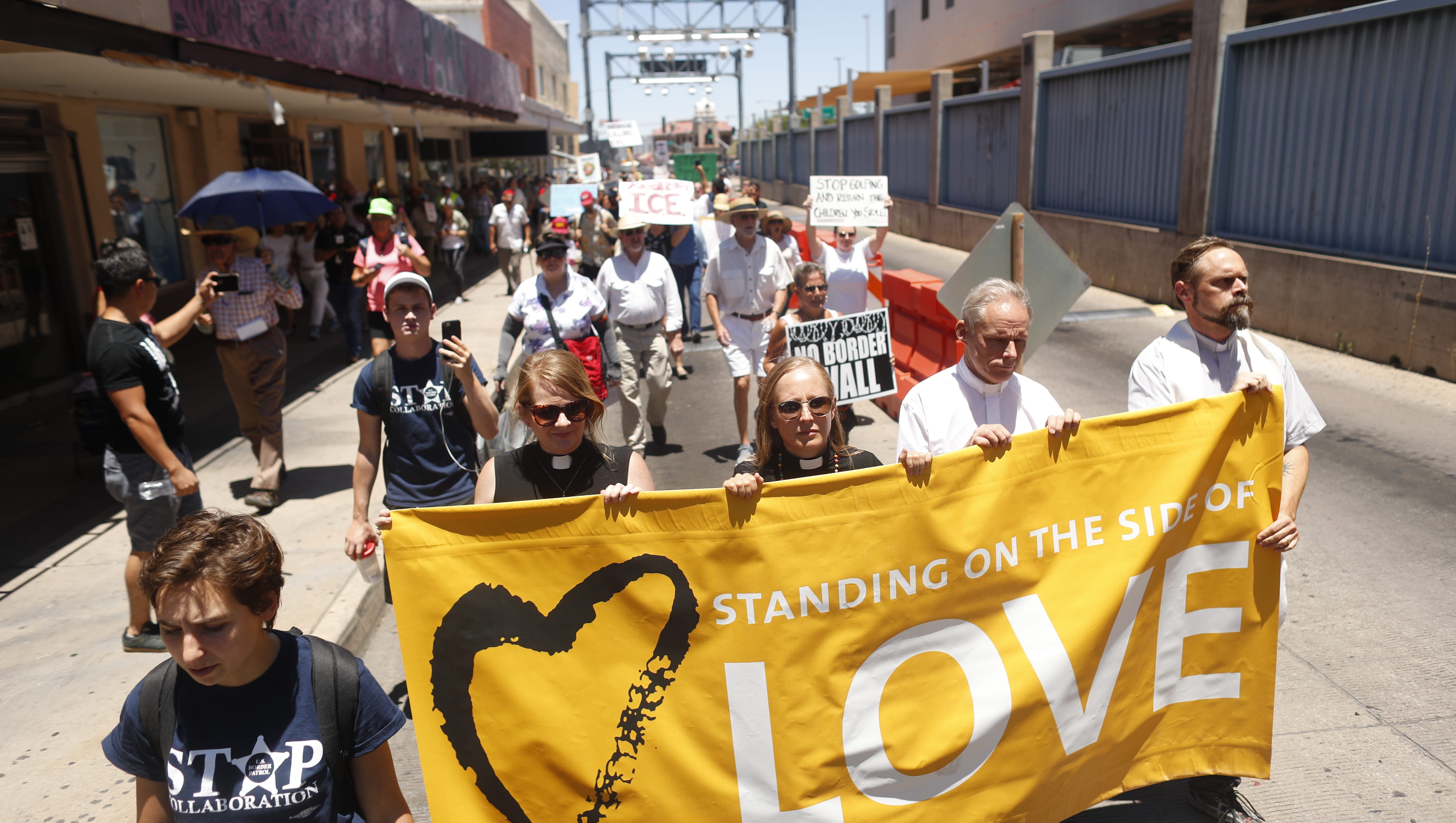 Protesters march into the DeConcini port to Mexico