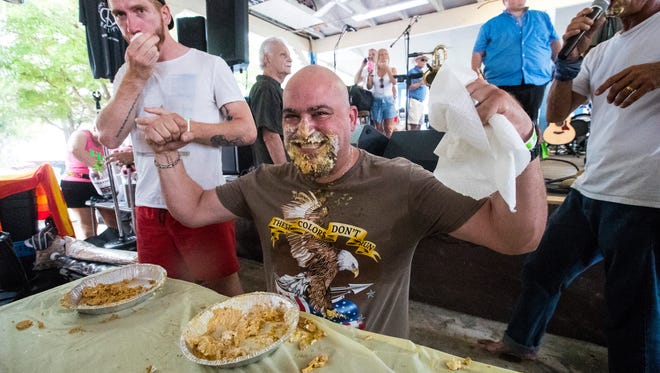The annual MangoMania always includes a pie-eating contest.