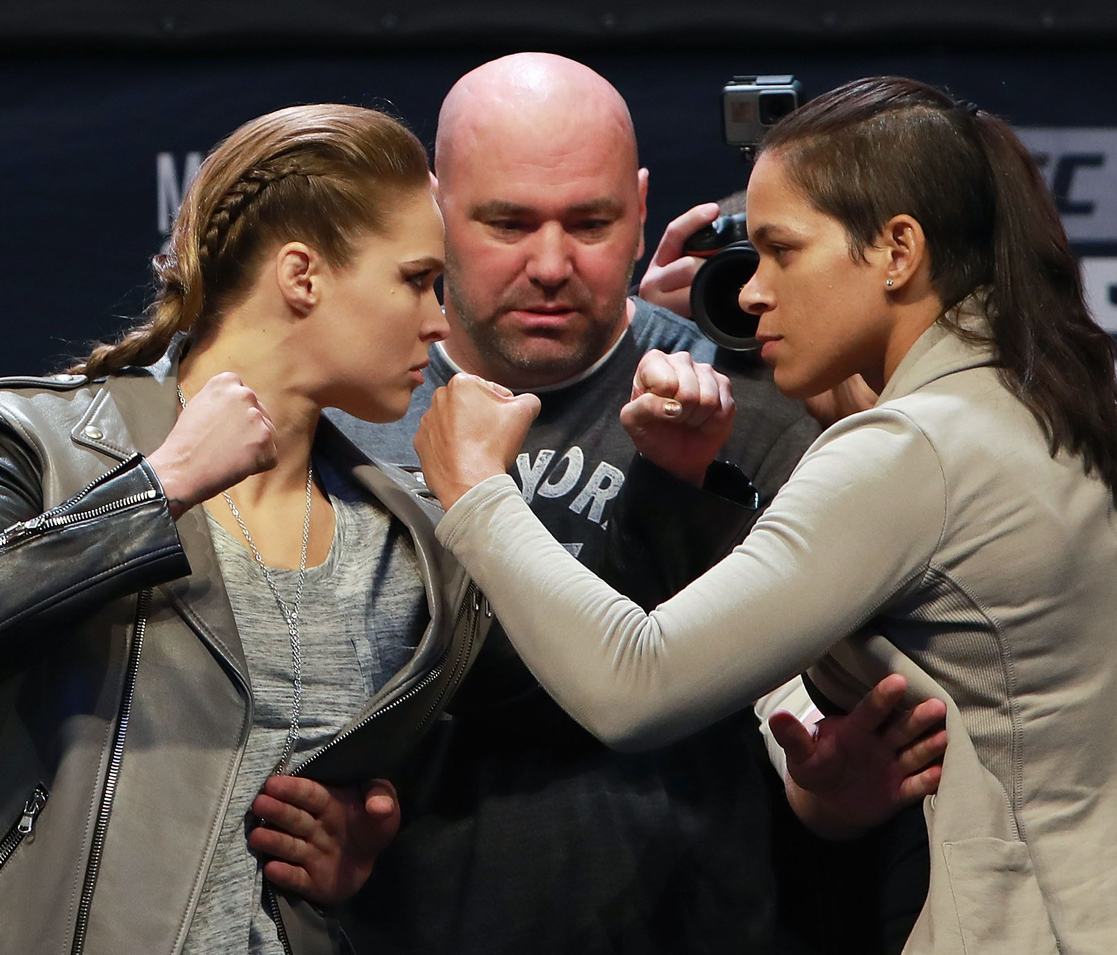 Dana White, center, says Ronda Rousey, left, is in peak mental and physical shape to take on Amanda Nunes on Friday.