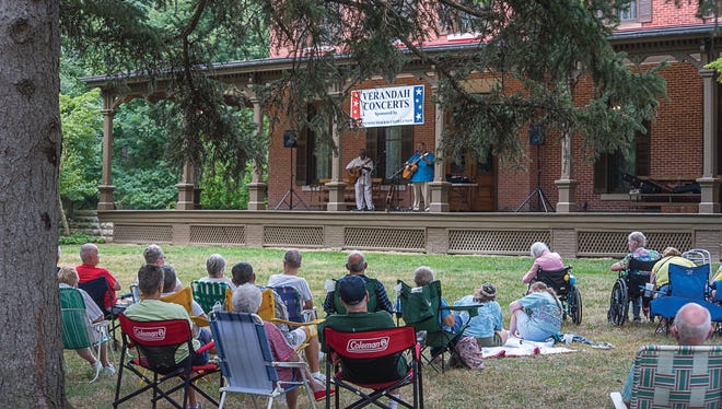 The Rev. Robert Jones and Matt Watroba perform American Roots music on the verandah of the Hayes Home in August 2016. The duo returns to the Hayes Presidential Library and Museums on July 26.