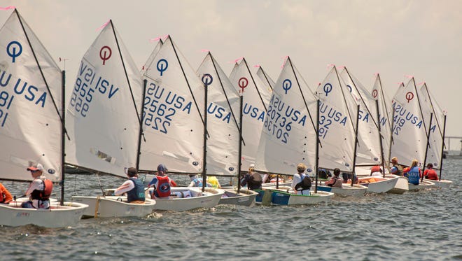Sailors make their way around the course Sunday, July 15, 2018 during the USA Optimist National Championship hosted by Pensacola Yacht Club.