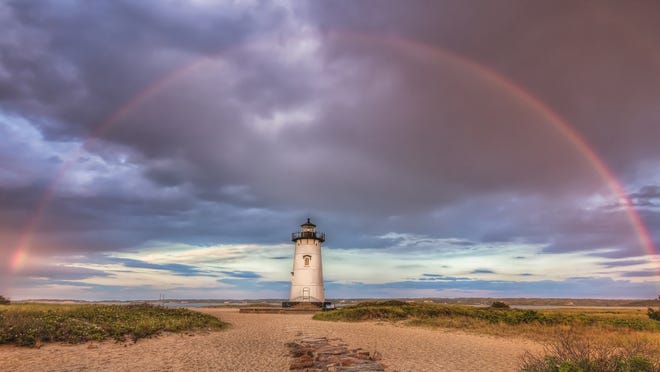 Edgartown Lighthouse is framed by a rainbow in this image from Martha's Vineyard photographer Michael Blanchard who credits his passion for photography with helping him to maintain his sobriety..
