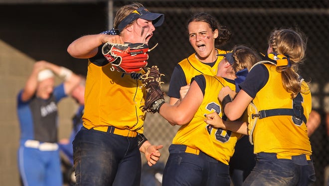 Notre Dame players, including winning pitcher Haylee Smith, left, celebrate their 5-4 win over Highlands in the Ninth Region championship game on Thursday. The Pandas will play Ashland Blazer to open the state tournament.