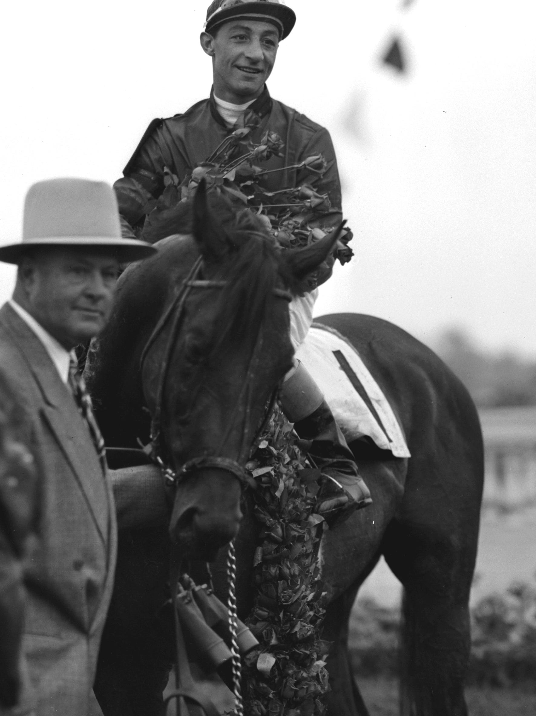 Citation, with jockey Eddie Arcaro aboard and trainer Ben Jones looking on, won the Kentucky Derby on May 1, 1948, and went on to win the Triple Crown.