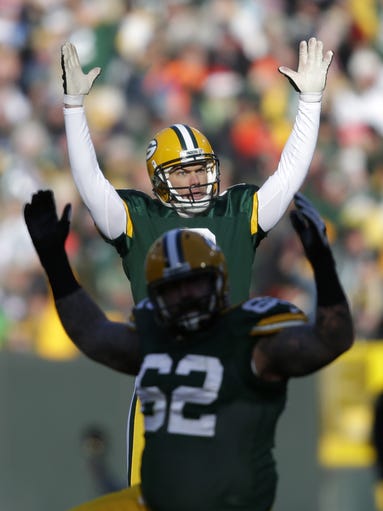 Mason Crosby celebrates making a 47-yard field goal
