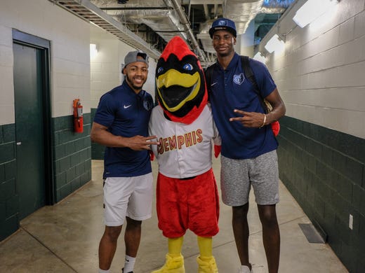 Jevon Carter and Jaren Jackson Jr pose with Rockey