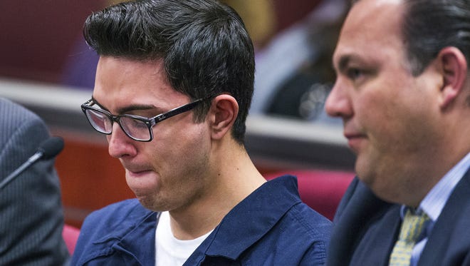 Steven Jones, 19, who is charged with first-degree murder and aggravated assault in the death of one NAU student and the wounding of three others on the Flagstaff campus on Oct. 9, 2015, gets emotional as Judge Dan Slayton grants release to in-home custody in Coconino County Superior Court in Flagstaff, Tuesday, April 12, 2016. His attorney, Burges McCowan, is to the right.