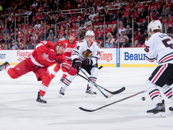 Detroit center Gustav Nyquist fires the puck past Chicago