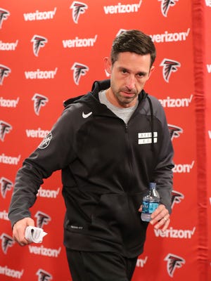 Atlanta Falcons offensive coordinator Kyle Shanahan leaves a news conference Jan. 11, 2017, in Flowery Branch, Ga.