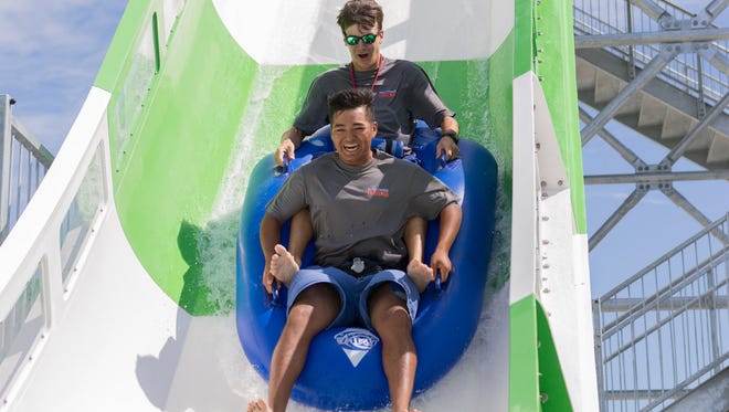 Riders in one- or multi-passenger rafts careen around water slide-like tracks. Blasts of water propel the vehicles through uphill sections, while gravity takes care of the rest.