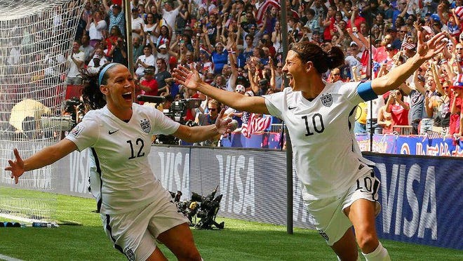 Lauren Holiday and Carli LLoyd celebrate during the 2015 FIFA Women’s World Cup.