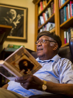 Author Ernest Gaines reads a selection from his debut novel
"Catherine Carmier" at his home library in Oscar.