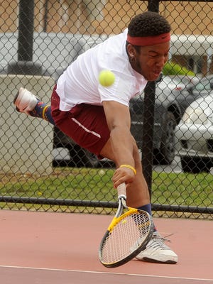 Newark's Robert Thomas lunges for the ball during a doubles match against Watkins Memorial's Sergio Santalla and Gavin Hollett on Tuesday, May 3, 2016. Thomas played first doubles for Newark with teammate Kaleb Diss.