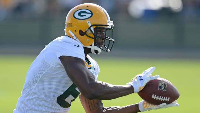 Green Bay Packers wide receiver Kevin Dorsey catches a pass on the second day of Packers training camp.