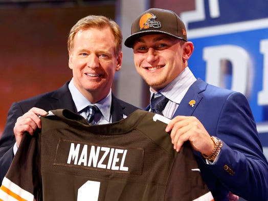 May 8, 2014: NFL Commissioner Roger Goodell presented Johnny Manziel with a Browns jersey after the Texas A&amp;M product and 2012 Heisman Trophy winner was picked 22nd overall by Cleveland during the draft's first round.