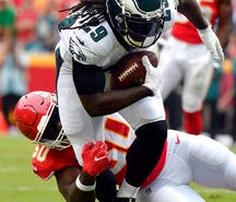 Eagles running back LeGarrette Blount (29) is tackled by Chiefs linebacker Justin Houston (50) after catching a pass for no gain.