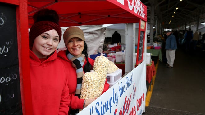 Christy Bryan and her mother, Treva Bryan, at their kettle corn stand at the Rochester Public Market.
