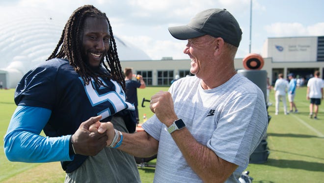 Titans outside linebacker Erik Walden (58) shares a laugh with his former college football coach from MTSU Rick Stockstill after the first training camp practice at Saint Thomas Sports Park Saturday, July 29, 2017 in Nashville, Tenn.