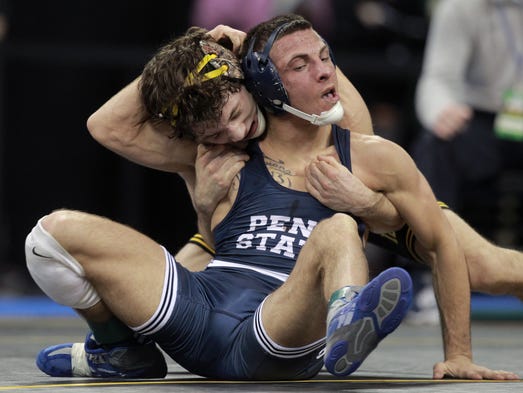 Iowa's Thomas Gilman wrestles Penn State's Nico Megaludis