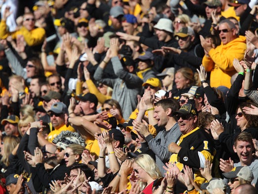 Iowa fans celebrate a missed field goal during the