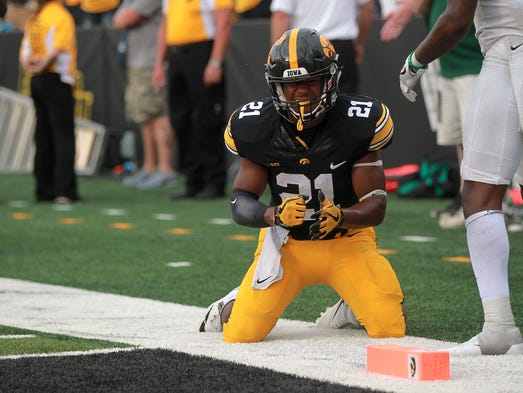 Iowa running back Ivory Kelly-Martin reacts as he gets