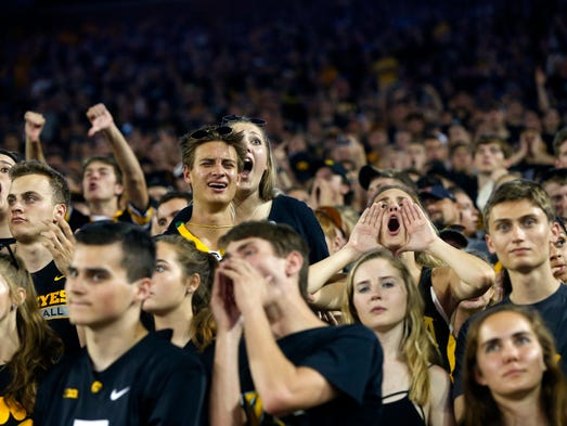 Iowa fans react to a call during the Hawkeyes' game