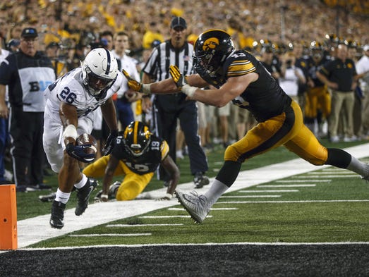 Penn State's Saquon Barkley scores a narrow touchdown