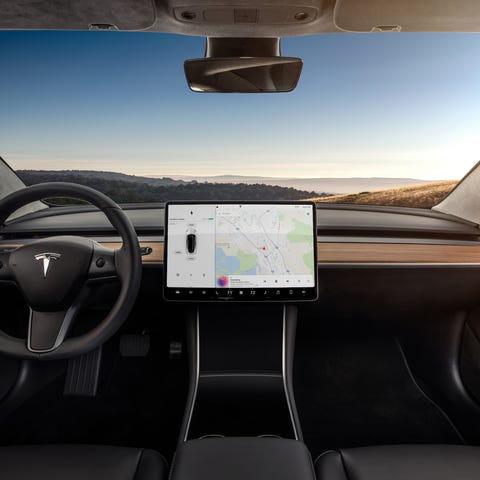 Interior of a Model 3 that's on a highway.