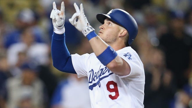 Yasmani Grandal of the Dodgers celebrates after hitting a home run.