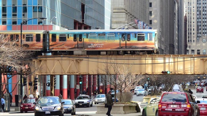 An elevated train picturing Montana’s promotion of Yellowstone National Park crossed traffic in downtown Chicago. Montana’s Office of Tourism and Business Development recently awarded the state’s $7 million annual marketing contract to a company based in Wisconsin.