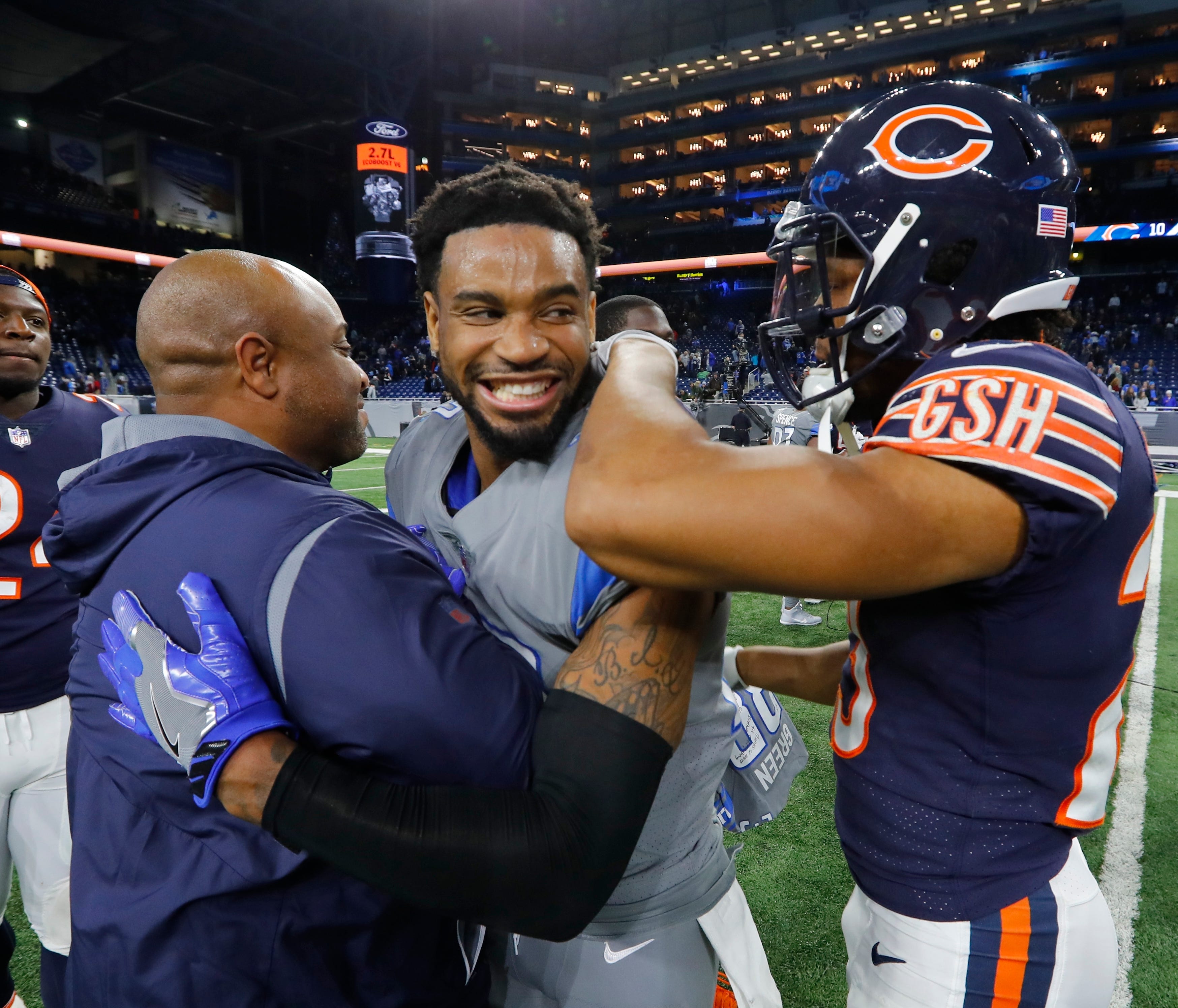 Detroit Lions cornerback Darius Slay (23) is greeted by Chicago Bears cornerback Kyle Fuller, right, after an NFL football game, Saturday, Dec. 16, 2017, in Detroit. (AP Photo/Paul Sancya)