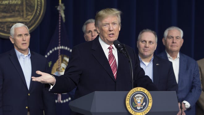 President Trump speaks to the press after holding meetings at Camp David on January 6, 2018 with staff, members of his Cabinet and Republican members of Congress.