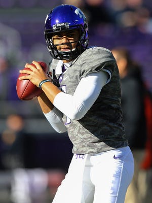 TCU Horned Frogs quarterback Kenny Hill (7) throws before the game against the Oklahoma State Cowboys at Amon G. Carter Stadium.