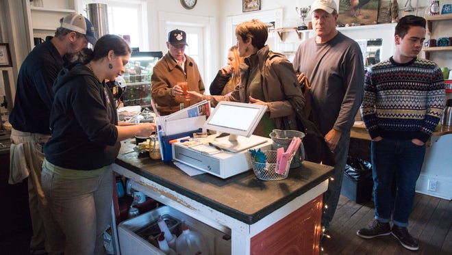 A long line of people hungry for lunch works its way into Louise's Kitchen last week.