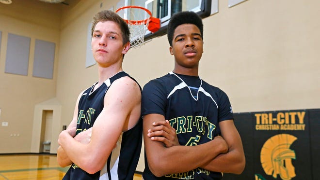 Tri-City Christian basketball players Brock Gardner (left)  and Nigel Shadd on Feb. 18, 2015 in Chandler. Bot players made the CAA boys basketball all-state team.