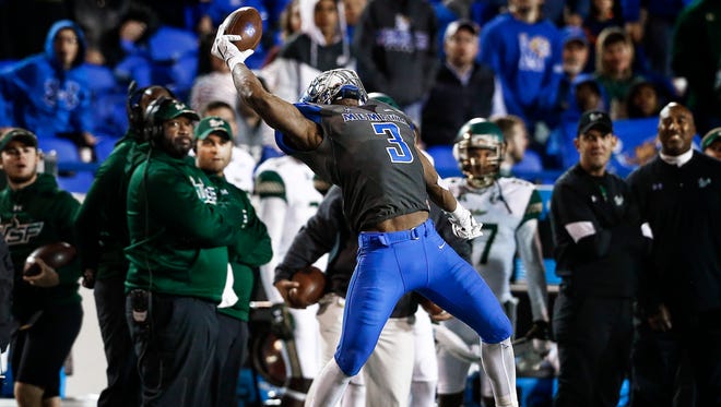 University of Memphis receiver Anthony Miller makes a one-handed catch against University of South Florida during third quarter action at the Liberty Bowl Memorial Stadium. 