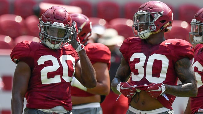 Shaun Dion Hamilton (20) was drafted Saturday by the Washington Redskins. In the next two years, fellow Montgomery native and G.W. Carver graduate Mack Wilson (30) is expected follow in his footsteps from Alabama to the NFL.