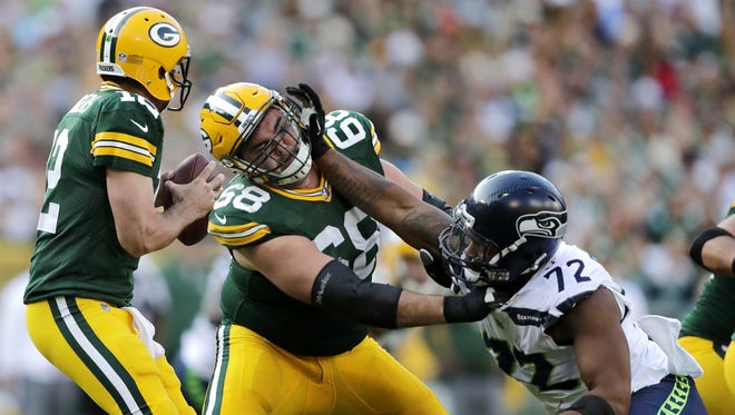 Green Bay Packers offensive tackle Kyle Murphy blocks for quarterback Aaron Rodgers against Seattle Seahawks defensive end Michael Bennett Sunday, Sept. 10, 2017, at Lambeau Field in Green Bay, Wis.