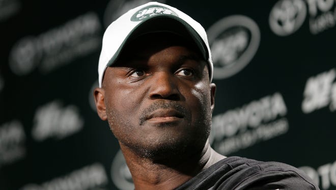 Jets coach Todd Bowles faces a complicated decision on who to start at QB. But only for one more week. (AP Photo/Seth Wenig)