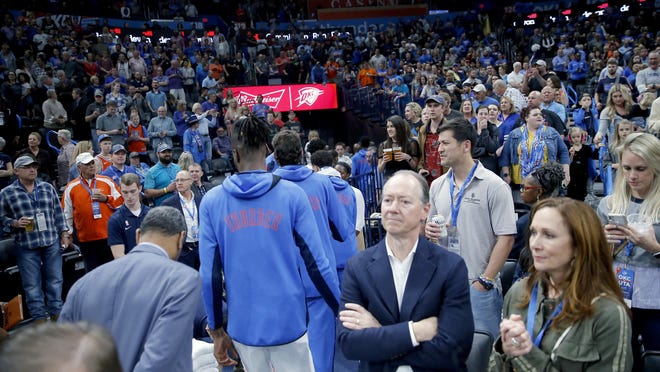 The Oklahoma City Thunder leave the court as the game against the Utah Jazz is postponed Wednesday in Oklahoma City.