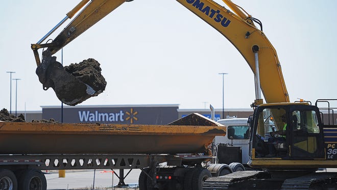 Construction crews work near the new Walmart location at the corner of 85th Street and South Minnesota Avenue Thursday, April 14, 2016 in Sioux Falls.
