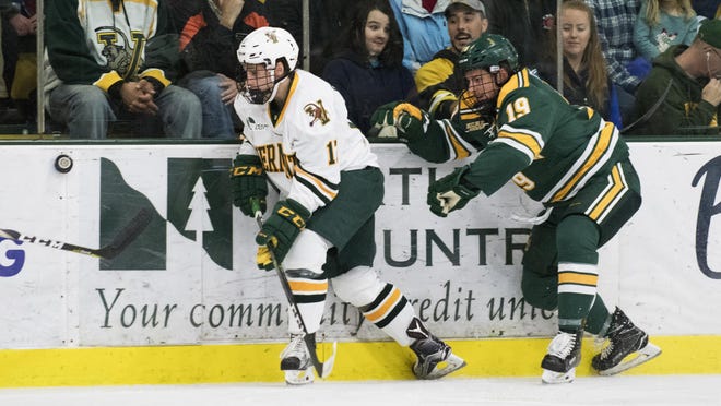 Vermont's Craig Puffer (17) plays the puck during the men's hockey game between the Clarkson Golden Knights and the Vermont Catamouts at Gutterson Fieldhouse on Saturday night.
