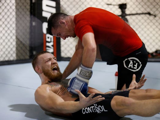 UFC featherweight champion Conor McGregor trains during