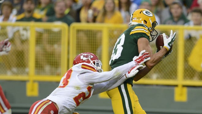 Green Bay Packers receiver Jeff Janis catches a touchdown pass against Chiefs cornerback Phillip Gaines during last year's preseason game at Lambeau Field. The familiar preseason foes will meet in the regular season this year.